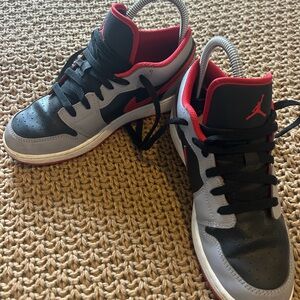 Nike Kids Black and Gray Air Jordans with Red Accents